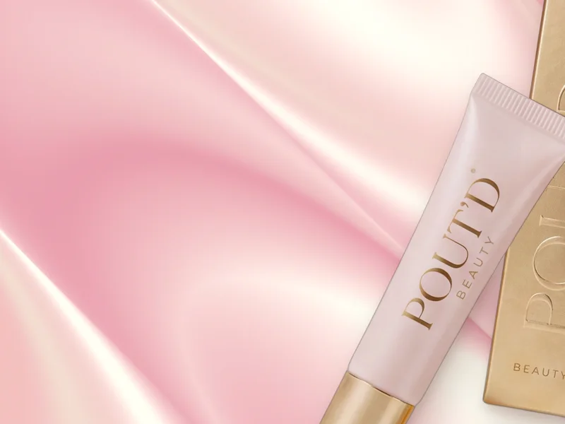 POUT'D Lip Plumper on pink silk: the non-sticky, high-shine plumper that keeps glossy, fuller-looking lips through dinner and drinks, $25